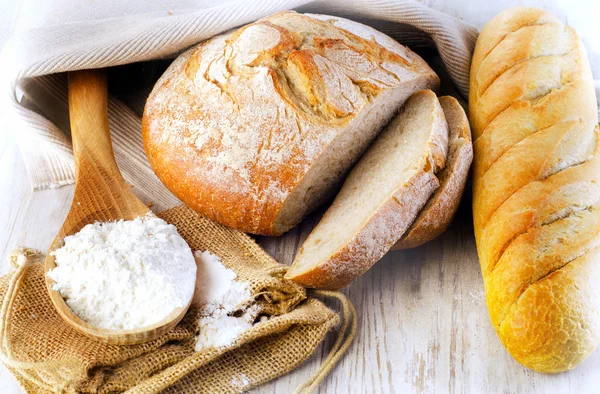 Fresh Bread on wooden table — Stock Photo, Image