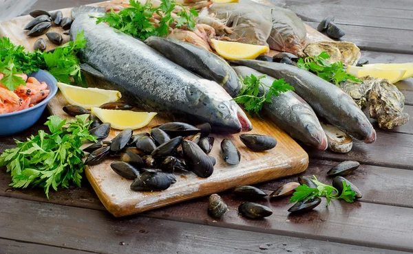Seafood with fresh herbs. — Stock Photo, Image