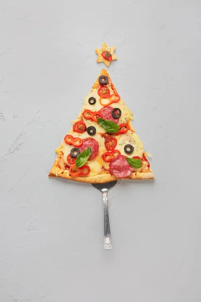 Piece of pizza set like christmas tree. Christmas and New year concept. Top view