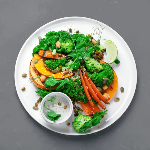 Grilled pumpkin salad with vegetables. Healthy vegan food. Top view