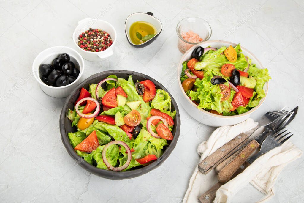 Fresh vegetables salad on light gray. Healthy eating concept. 