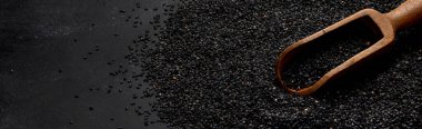 Black sesame seed on black background. Organic food concept. Copy spac