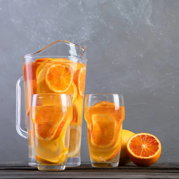 Refreshing Orange Lemonade Grey Wooden Table Summer Drinks Concept Top — Stockfoto