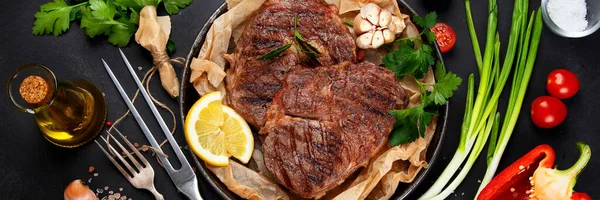 Delicious Prepared Meat Steaks Seasoning Herbs Dark Background Geilled Food — Zdjęcie stockowe