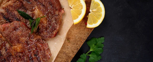 Delicious Prepared Meat Steaks Seasoning Herbs Dark Background Geilled Food — Zdjęcie stockowe