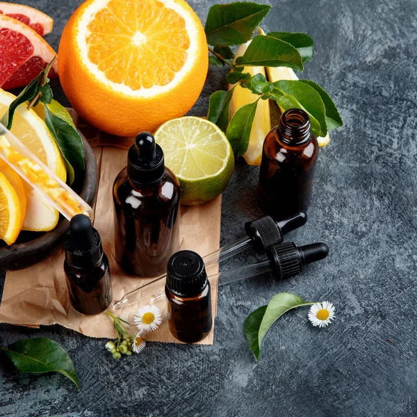 Bottles Essential Aroma Oils Citrus Dark Gray Background Top View — Stock Photo, Image