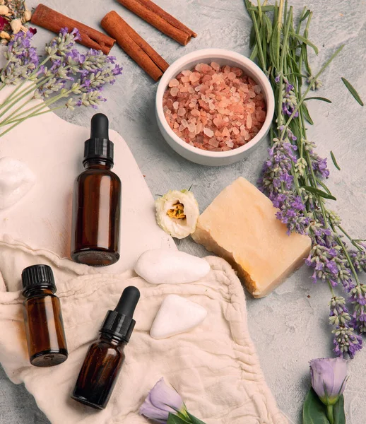 Bottle Essential Oils Herbs Flowers Light Gray Background Top View — Stock Photo, Image