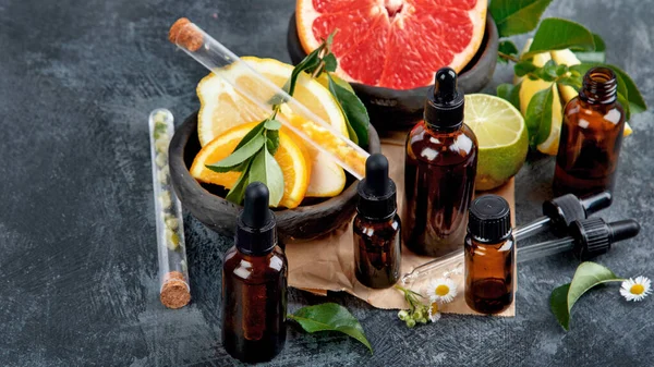 Bottles Essential Aroma Oils Citrus Dark Gray Background Copy Space — Stock Photo, Image
