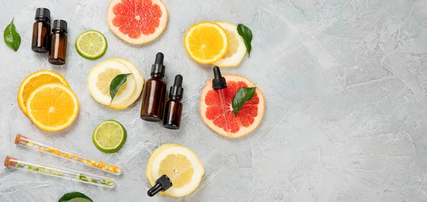 Bottle Essential Aroma Oils Citrus Light Gray Background Top View — Stock Photo, Image
