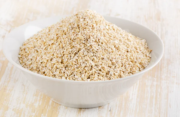 Healthy Oat bran on a  wooden table — Stock Photo, Image