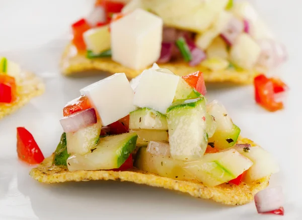 Corn nachos with vegetables and cheese. — Stock Photo, Image