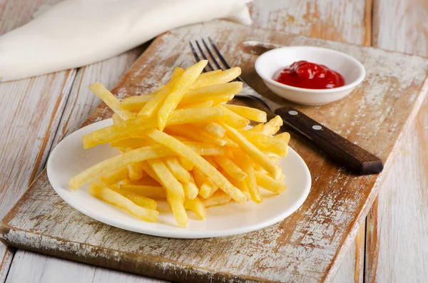 Fries on  wooden table — Stock Photo, Image