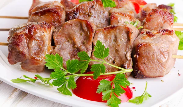 Pork kebabs served  on  white plate — Stock Photo, Image
