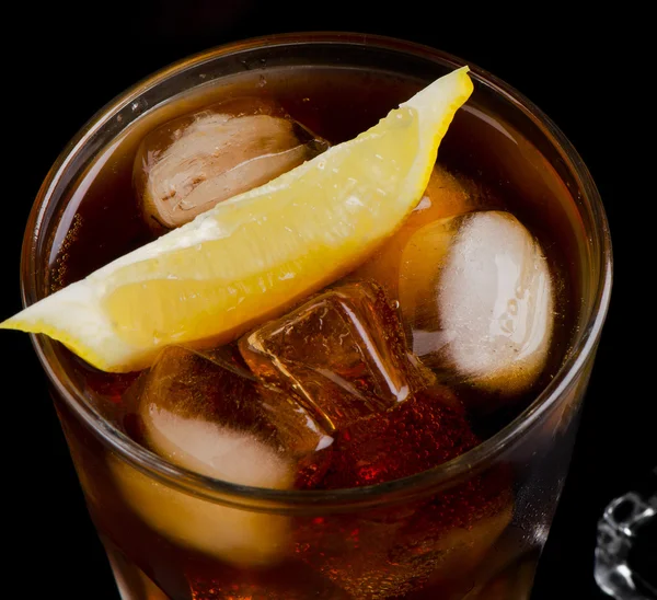 Glass of cola with lemon — Stock Photo, Image