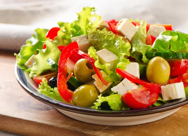 Fresh greek  salad with feta, olives and vegetables . — Stock Photo, Image