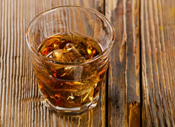 Glass of whiskey with ice — Stock Photo, Image