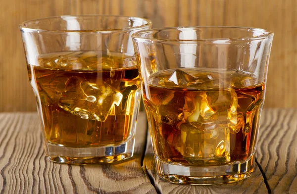 Glasses of whiskey with ice — Stock Photo, Image