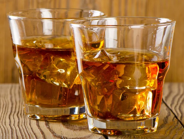 Glasses of whiskey with ice — Stock Photo, Image