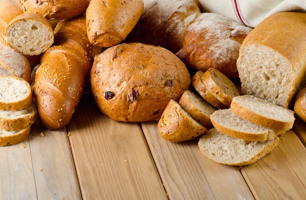 Bread on  wooden background — Stock Photo, Image