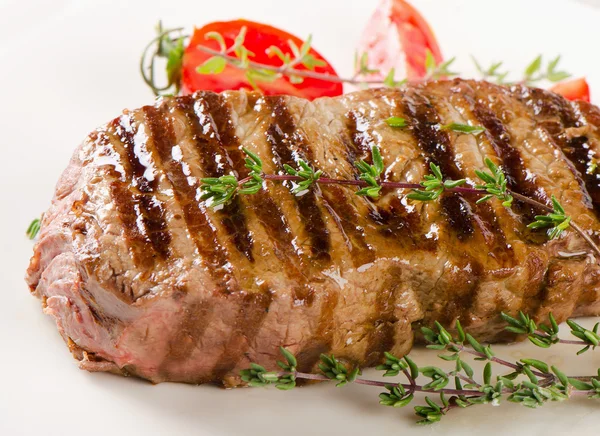 Beef steak with herbs — Stock Photo, Image