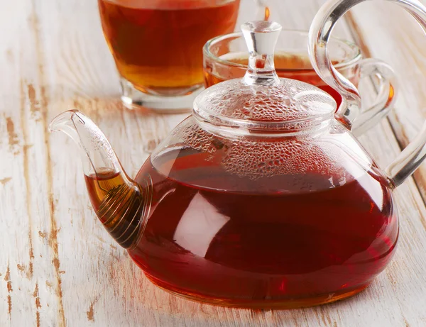 Teapot and cups of tea — Stock Photo, Image
