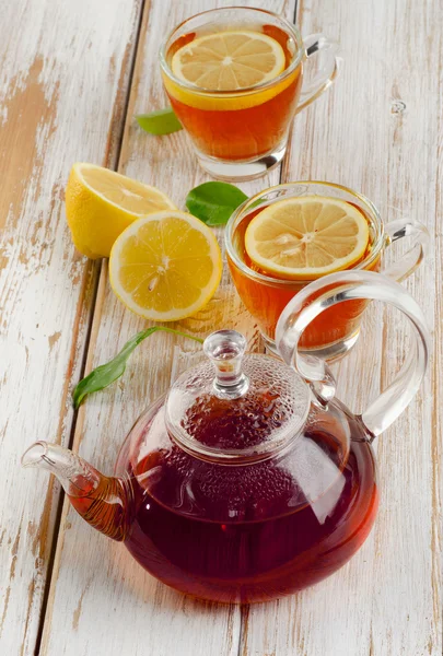 Teapot and cups of tea — Stock Photo, Image