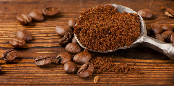 Coffee beans on spoon — Stock Photo, Image