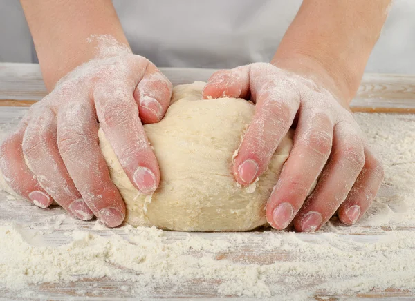 Hands kneading dough — Stock Photo, Image