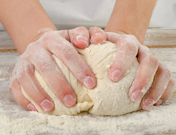 Hands kneading dough — Stock Photo, Image