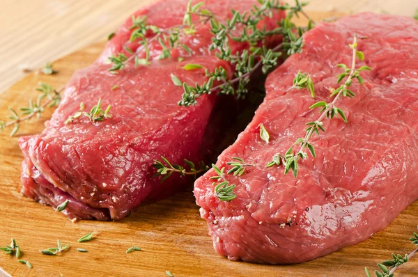 Raw  steak with herbs — Stock Photo, Image