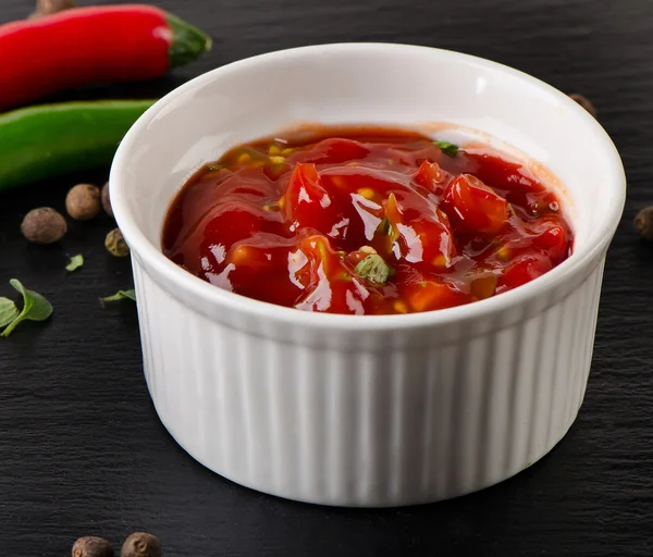 Bowl of salsa dip with peppers — Stock Photo, Image