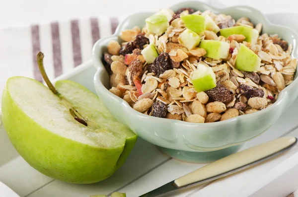 Healthy bowl of muesli and  apple — Stock Photo, Image