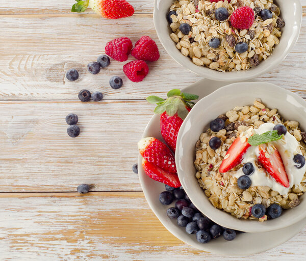 Muesli,  fresh berries and yogurt for healthy breakfast.