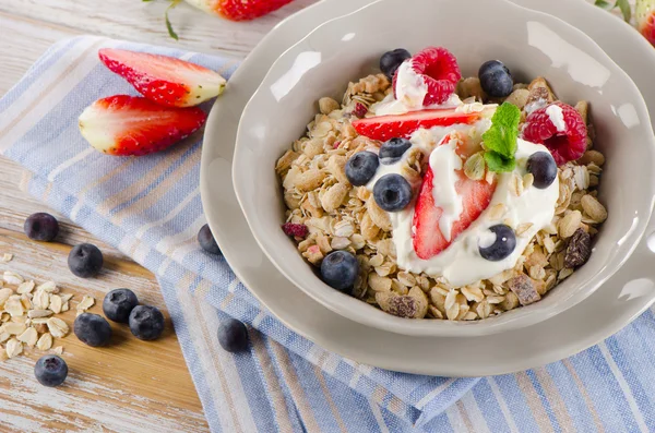 Fresh berries, yogurt and  muesli. — Stock Photo, Image