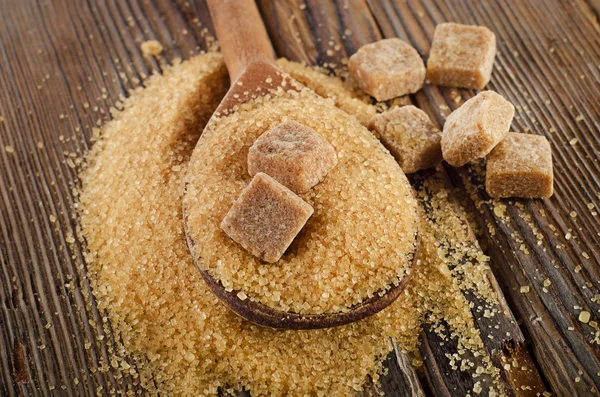 Cane Sugar in  wooden spoon — Stock Photo, Image