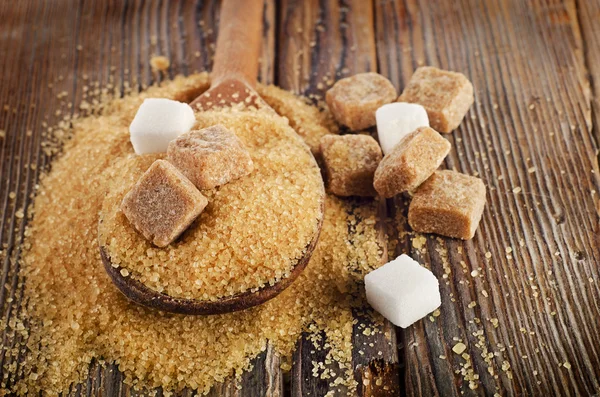 Cane Sugar in  wooden spoon — Stock Photo, Image