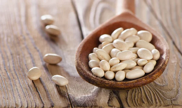 White beans in the spoon. — Stock Photo, Image