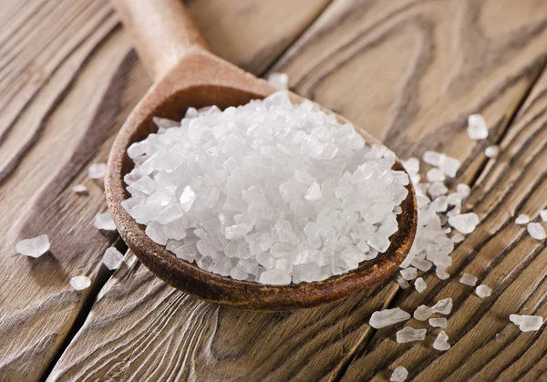 Salt in wooden spoon — Stock Photo, Image