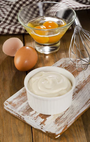 Mayonnaise in bowl with eggs — Stock Photo, Image