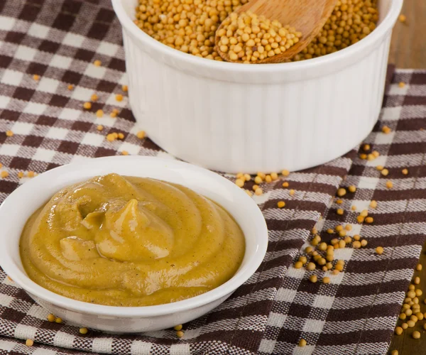 Mustard in white bowls Stock Photo