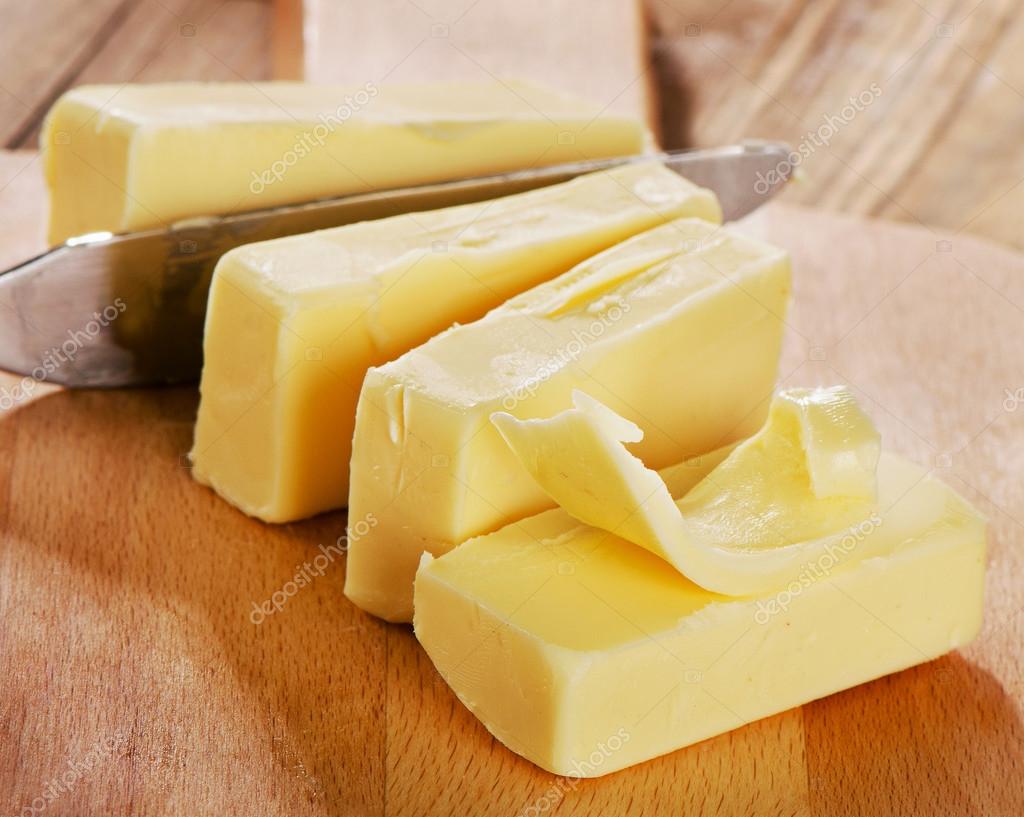 Butter on cutting board. — Stock Photo © bit245 68243721
