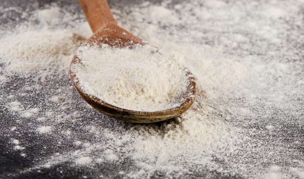 Flour in a wooden spoon. — Stock Photo, Image