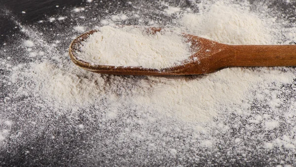 White Flour in a old  wooden spoon. — Stock Photo, Image