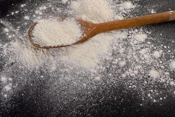 Flour in a old  wooden spoon. — Stock Photo, Image