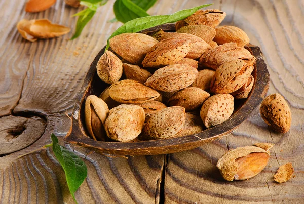 Almonds  on wooden table — Stock Photo, Image