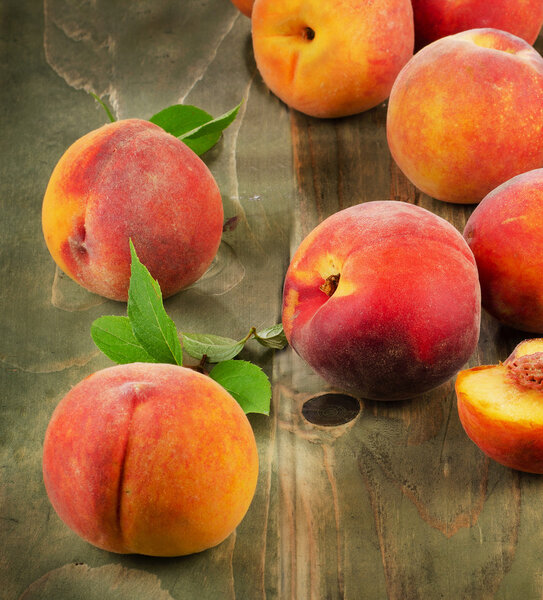 fresh peaches on a wooden table