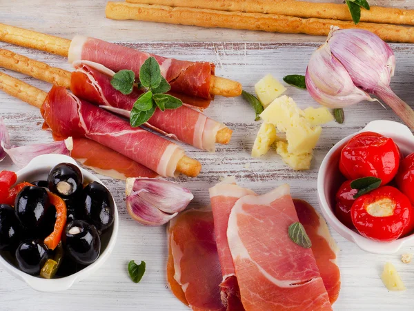 Mixed Antipasto on a wooden table — Stock Photo, Image