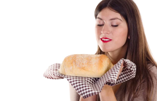 Woman holding fresh baked bread — Stock Photo, Image