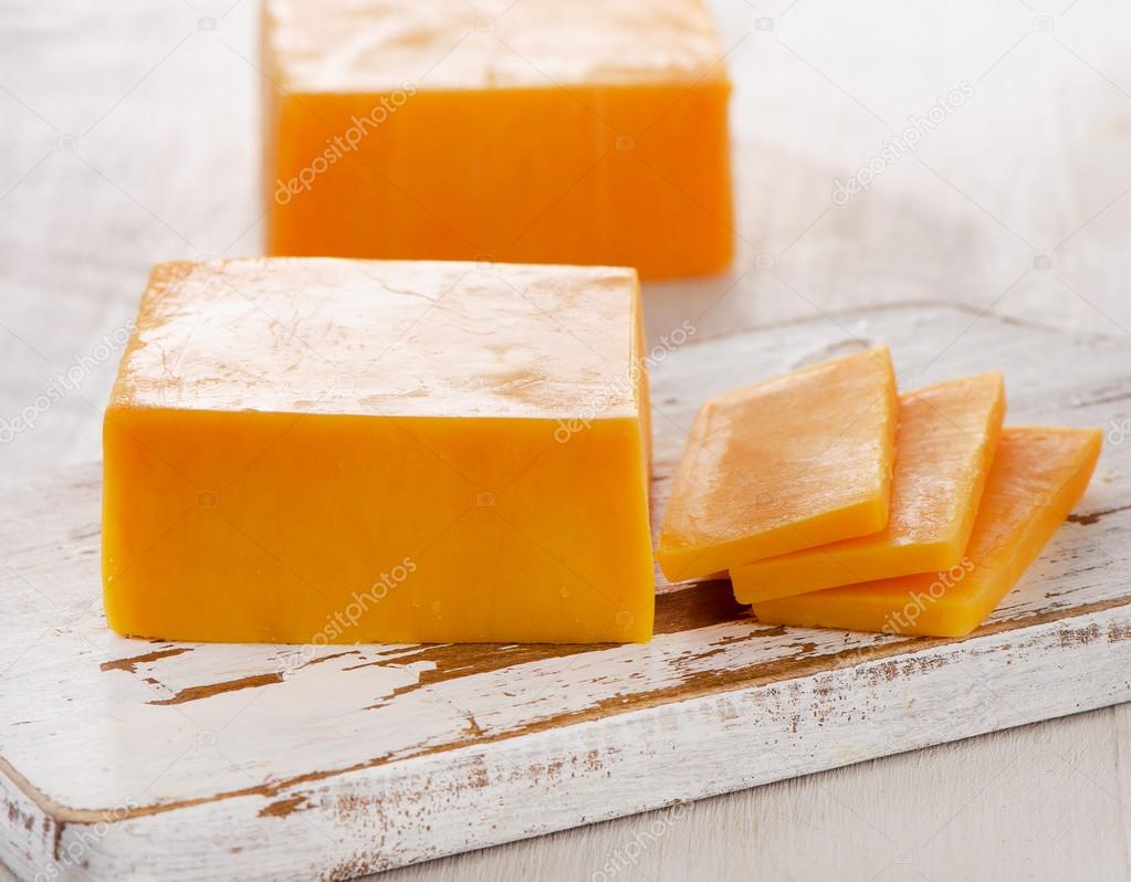 Cheddar Cheese on   Cutting Board.