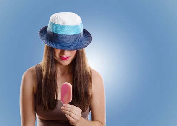 Young woman holding  ice cream on  blue — Stock Photo, Image